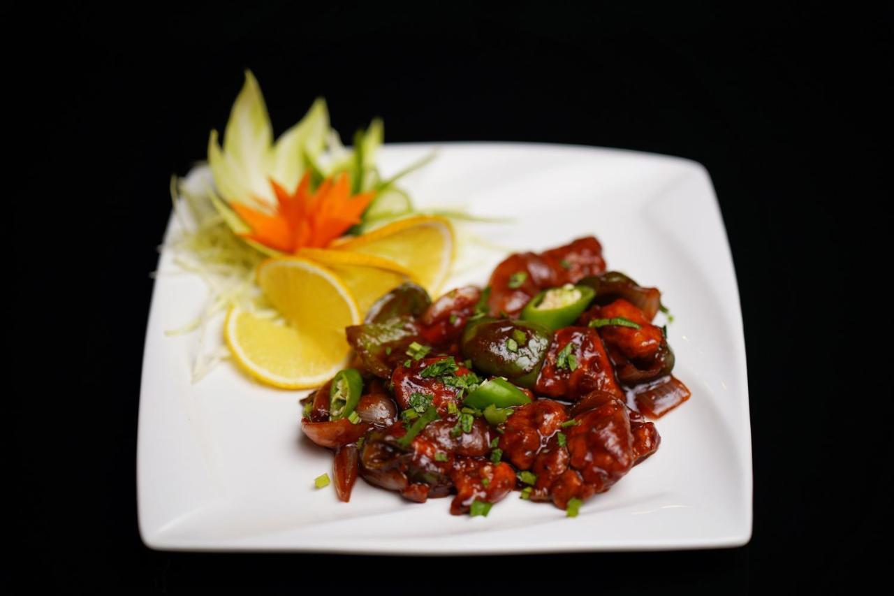Elephant Passage Munnar Exterior photo A plate of chilli chicken